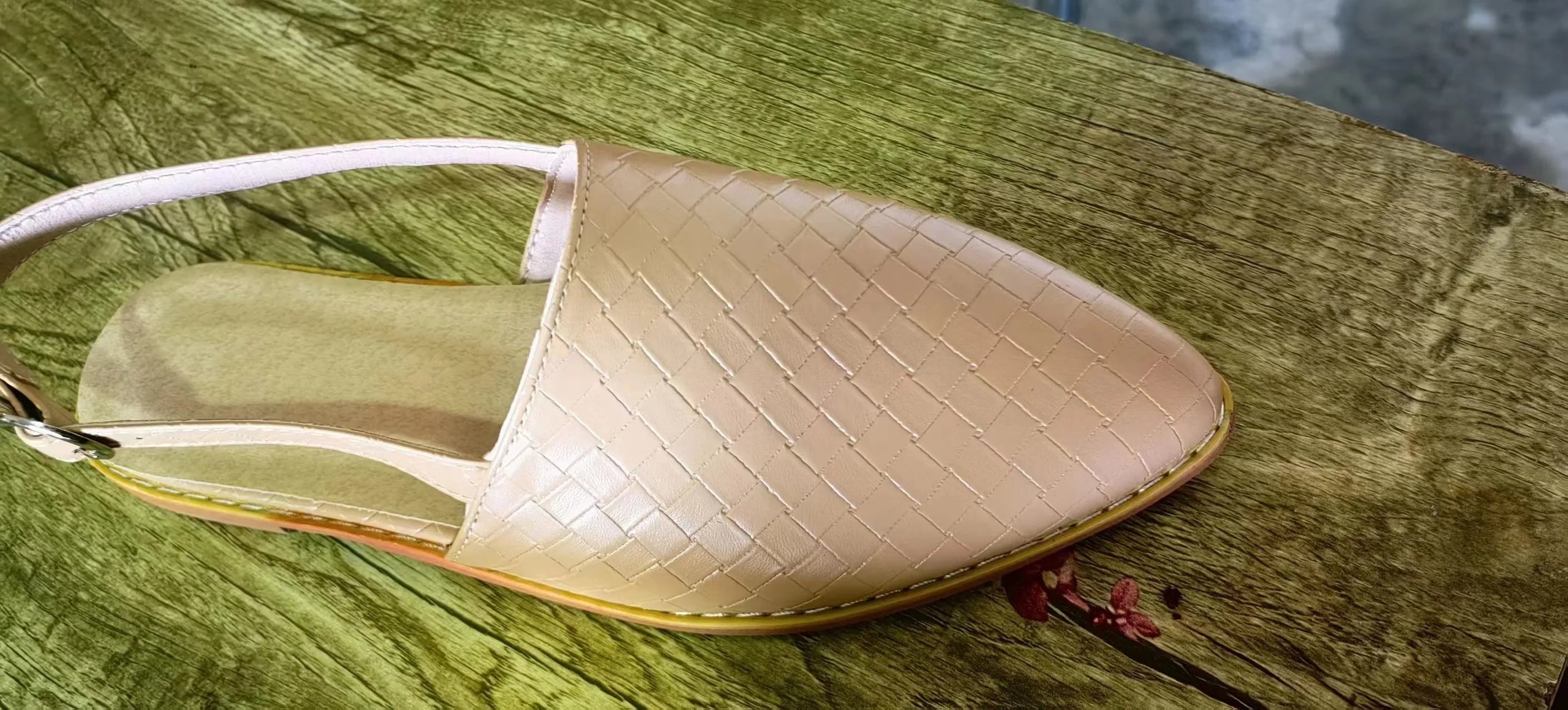 Baotou flat sandals with a buckle fastening and pointed toe, shown in a selection of colours.