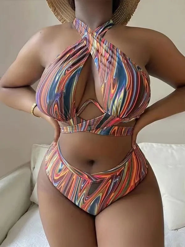 Women's floral print high-waisted bikini swimsuit with split sides.