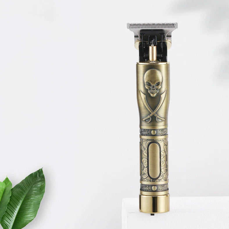Gold skull hair clipper with USB charging port and cutting blades