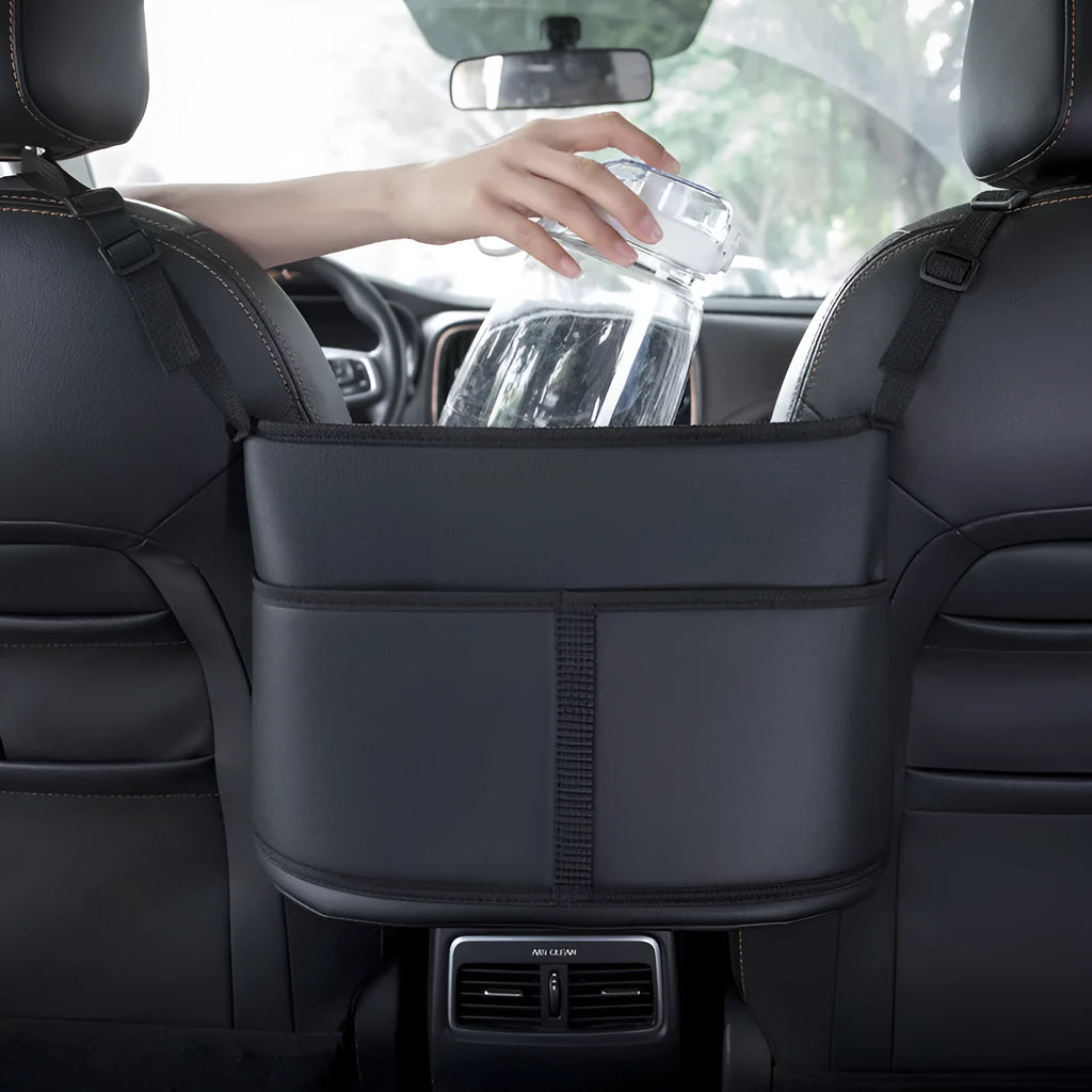 Black leather car seat net pocket storage bag measuring 38cm mounted between vehicle seats