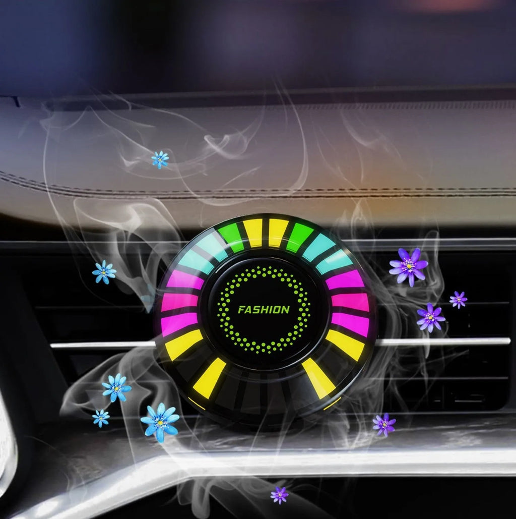 RGB car air outlet aromatherapy light with 3D rhythm effects mounted in a car vent.