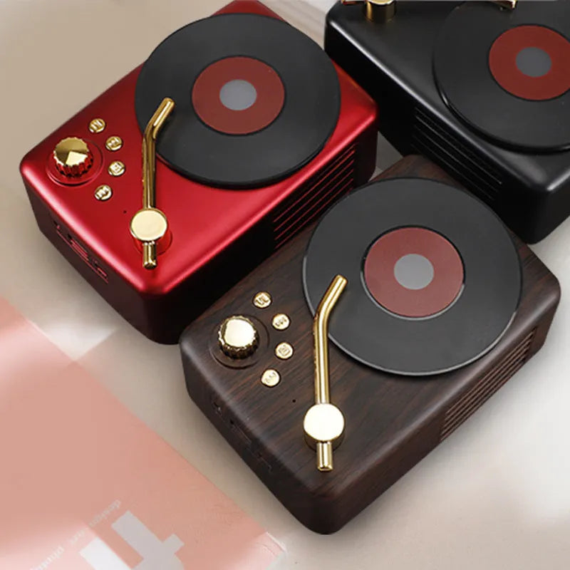 T12 compact Bluetooth record player with vinyl turntable, dual speakers, and wireless streaming in a black finish