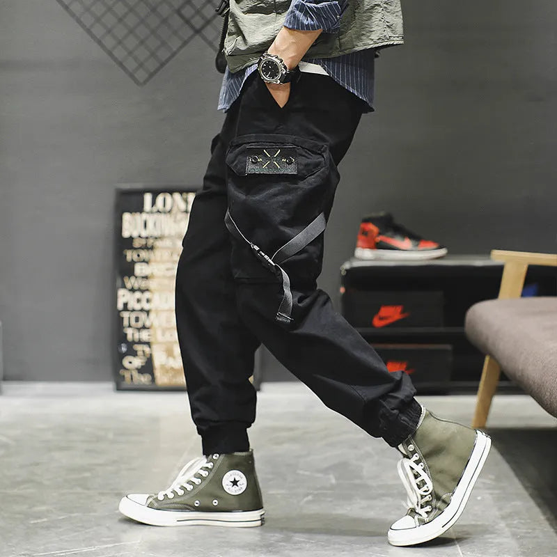 Men's casual cotton cargo pants in black with multiple pockets, available in Asian sizes S to XL