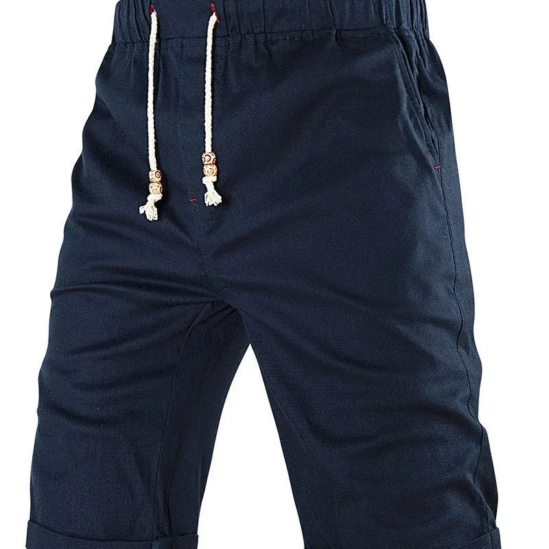 Men's solid colour casual shorts with a drawstring waistband and a zipper pocket on the leg.