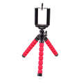 Mini flexible octopus tripod stand with sponge legs holding smartphone