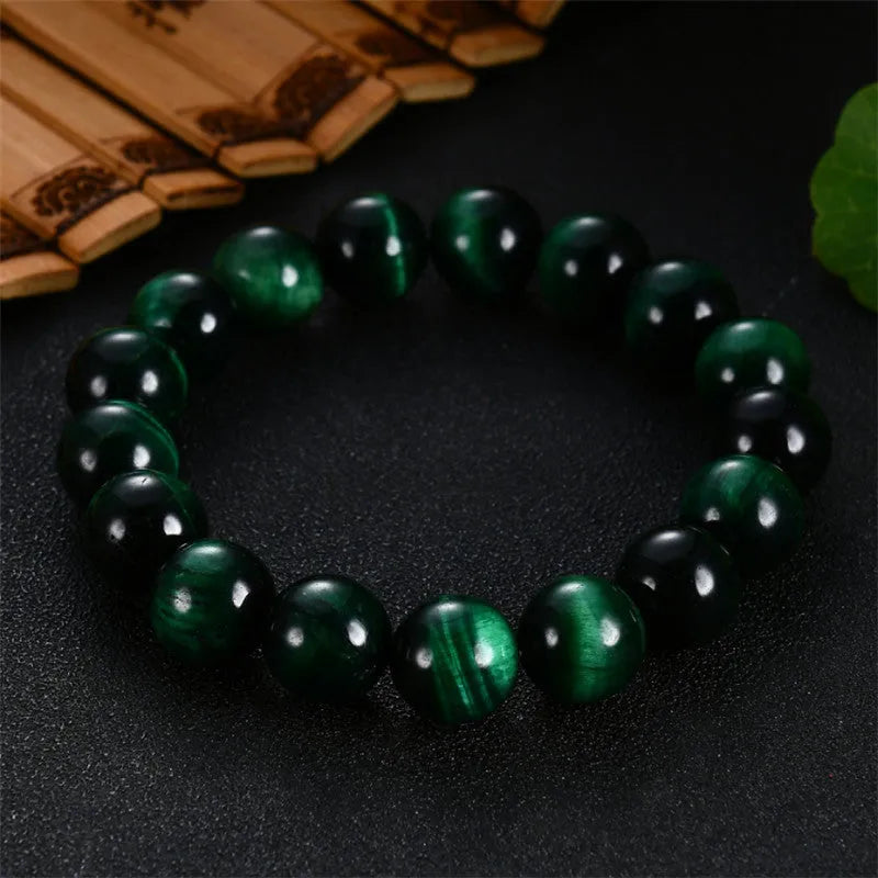 Green tiger eye stone geometric bead bracelet shown in different size options on a wrist.