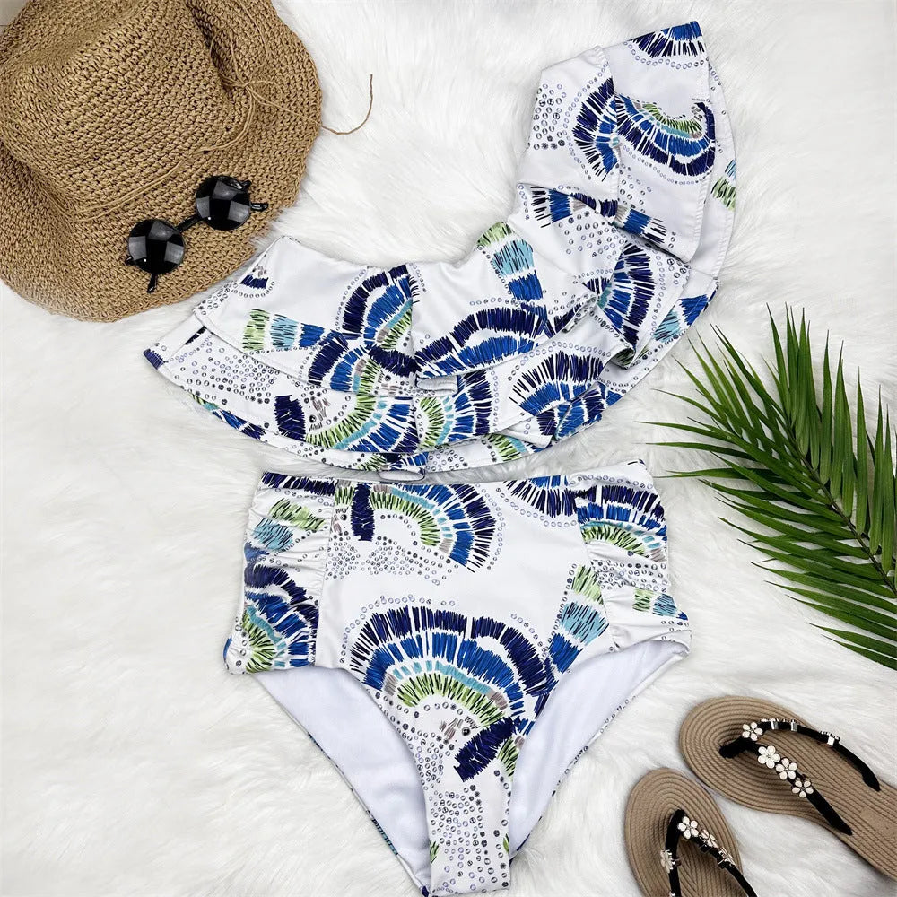 White one-shoulder women's swimsuit with double-layer fabric and large lotus leaf hem detail.