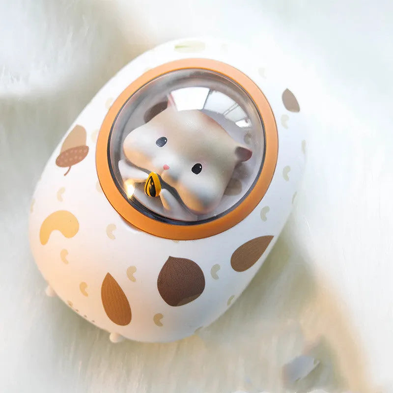 White Hamster brand hand warmer and power bank with 5000mAh capacity on a plain background.