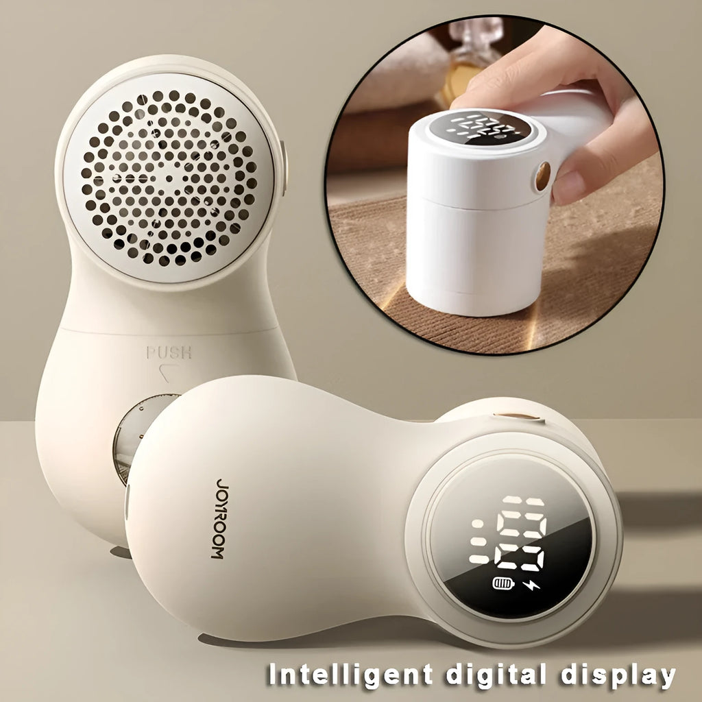 White electric lint remover with LED display and USB port on a fabric background.