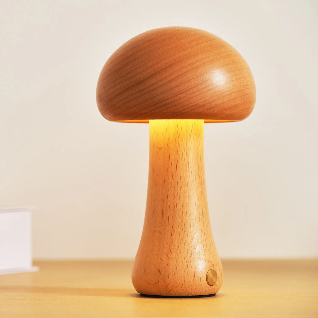 Solid beech wood mushroom shaped LED bedside lamp with warm light on a wooden nightstand