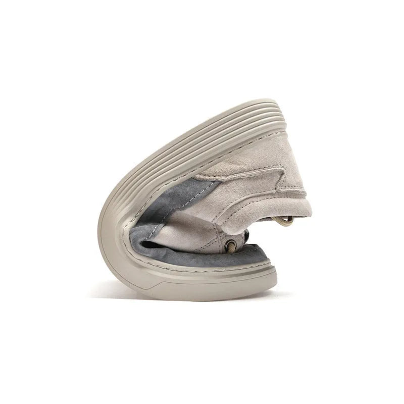 Men's grey pigskin leather low-top casual skate shoes with round toe and flat rubber sole.