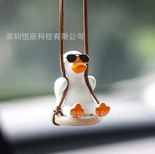 Gypsum duck ornament with swing tire design measuring 6x5x6cm for decorative displays