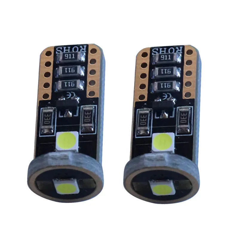 Single T10 W5W LED car interior light bulb with bright white LEDs on a dark board.