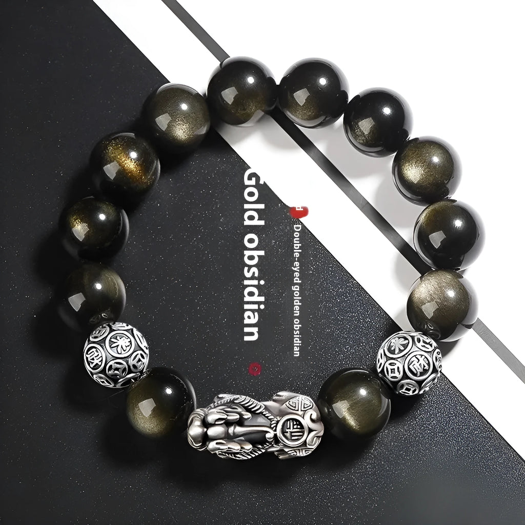 Men's geometric bracelet made of black obsidian and polished 999 sterling silver, showing its width and structured design.