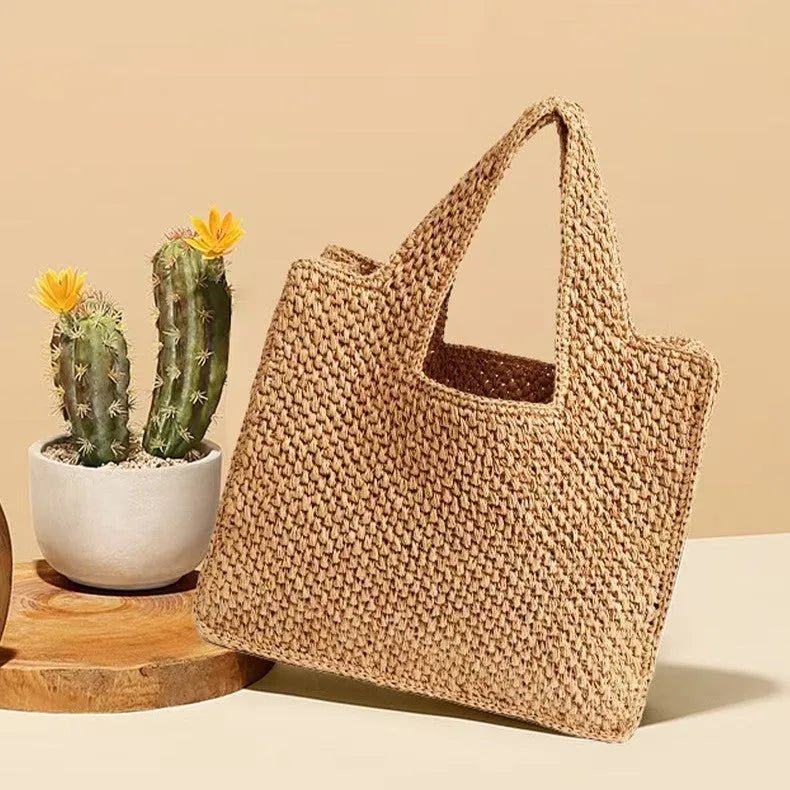 Straw woven bucket tote bag with double shoulder straps in horizontal square shape