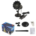 LED Christmas snowflake laser projector with white snowfall pattern on a garden lawn at night
