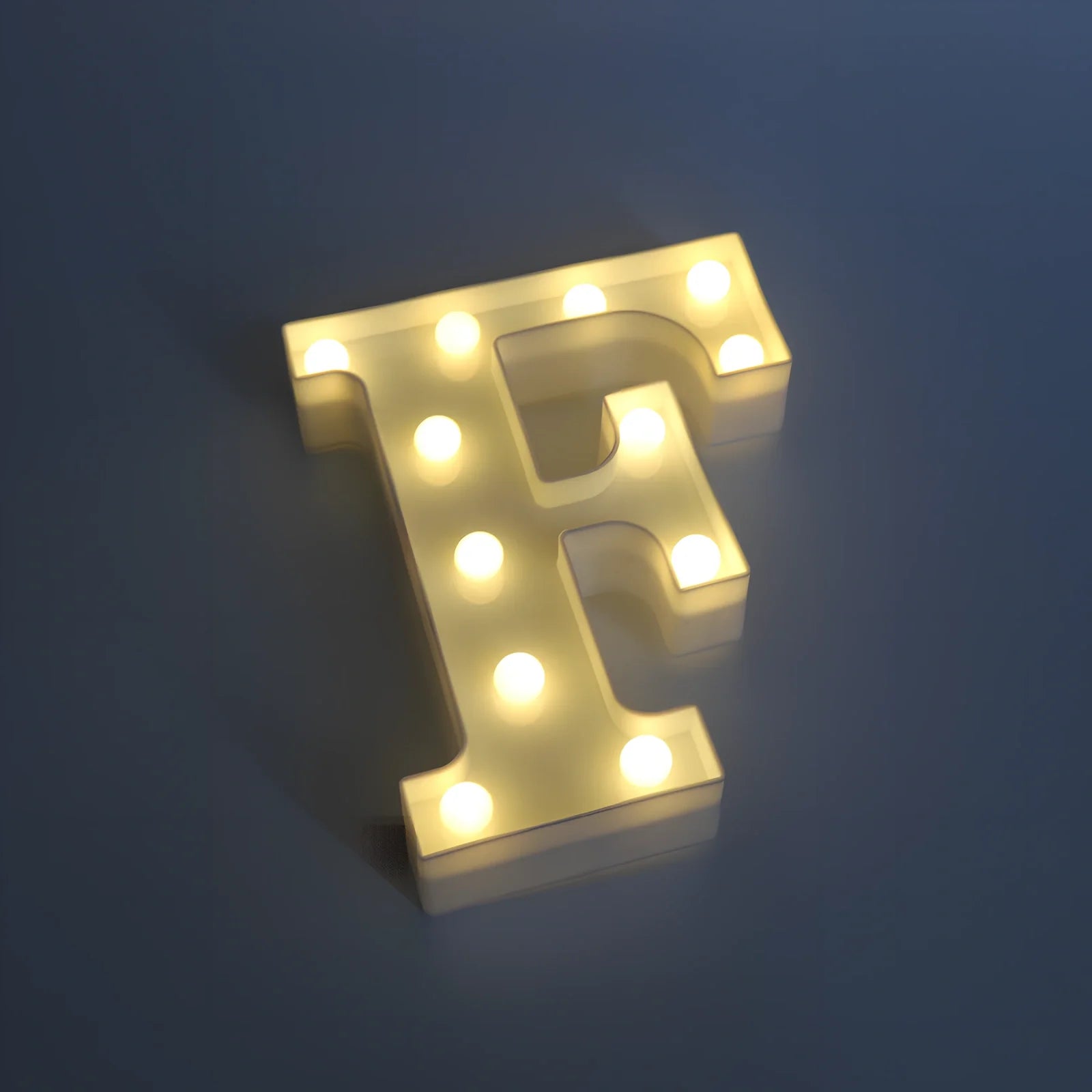 White plastic LED alphabet marquee sign with warm white illumination, 22cm height with battery operation