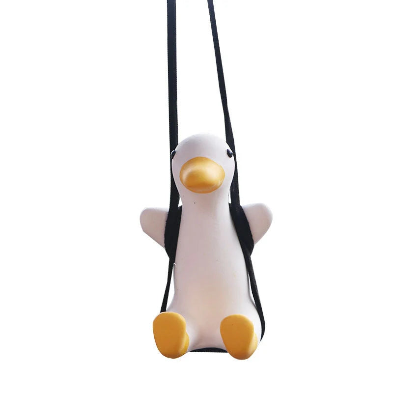 Swing Duck Car Pendant hanging from a rearview mirror, showcasing vibrant colors and unique design