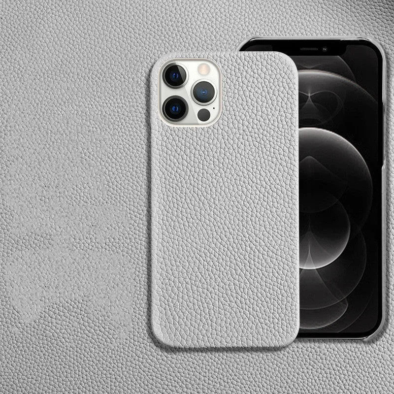 Genuine leather protective case for iPhone in simple half-wrap design on a table.