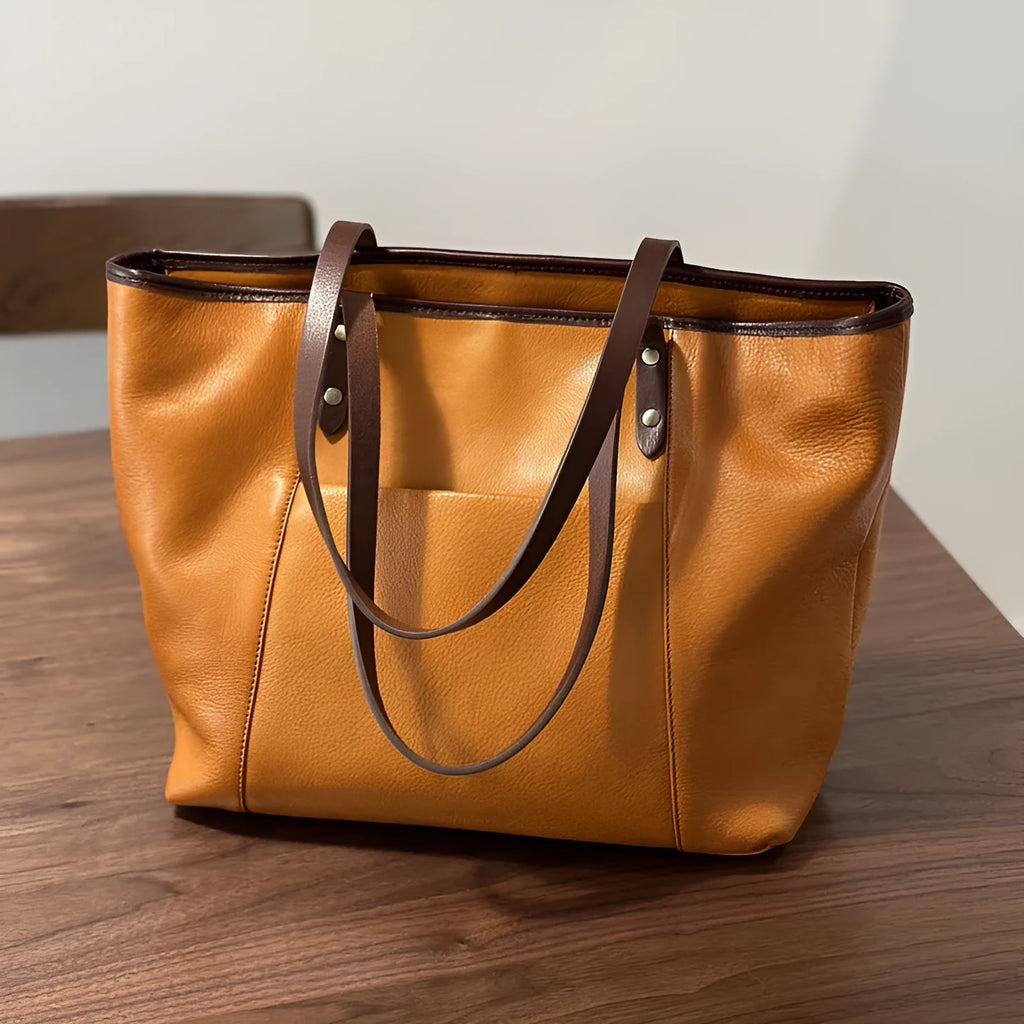 Horizontal square first-layer cowhide leather single-shoulder bag in brown with sewing thread detail and multiple pockets