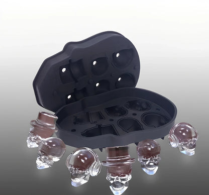 Black silicone ice cube tray with four skull-shaped cavities measuring 12cm long