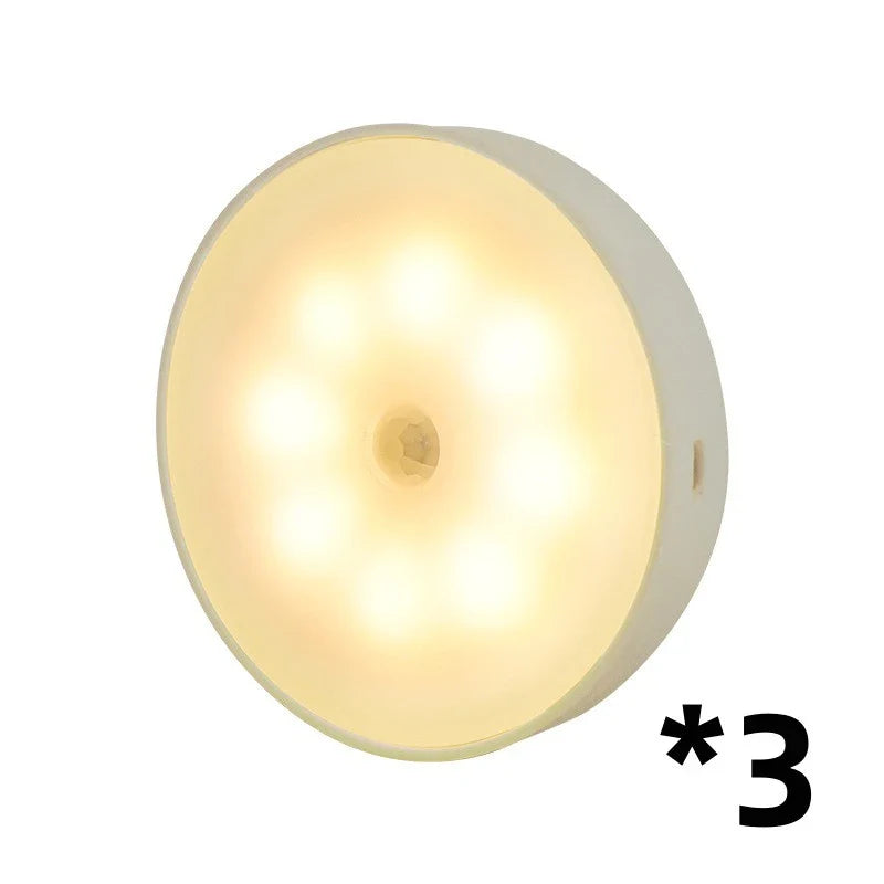 USB rechargeable motion sensor LED puck light for cabinets and night use