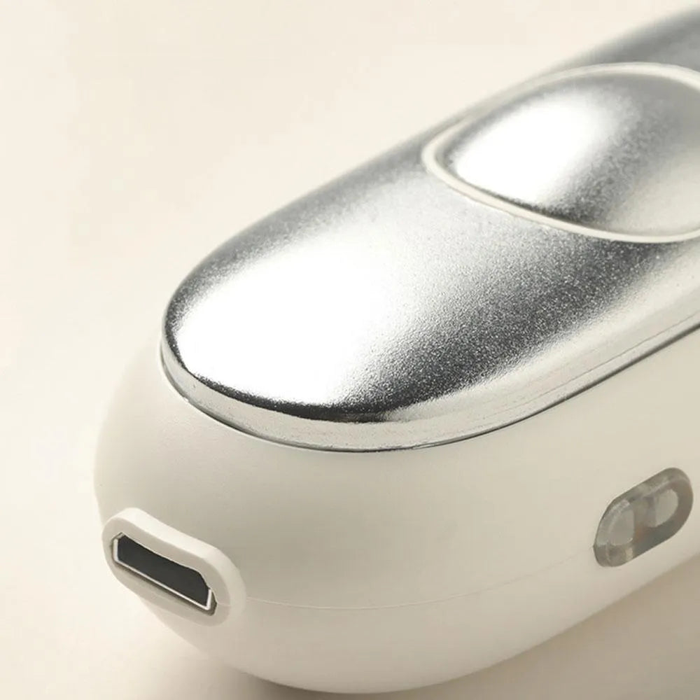 Handheld micro-current sleep aid device with round button and USB charging port