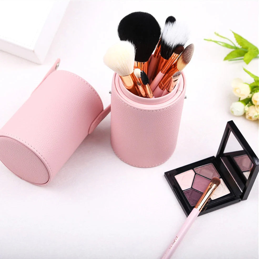 12 synthetic makeup brushes with aluminium handles and wooden accents in cosmetic case