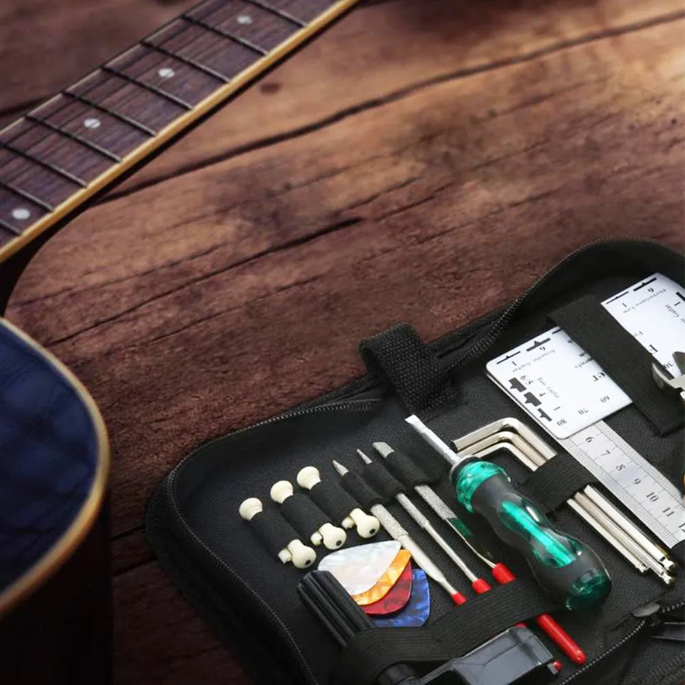 Black plastic and metal guitar repair tool kit for guitar bass mandolin banjo