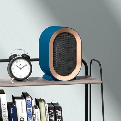Mini Portable PTC Ceramic Heater on a desktop, showcasing its compact design and efficient heating.
