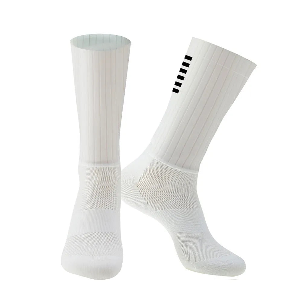 Cycling and running socks in chemical fibre blend fabric shown in orange, black, purple, white, grey, and dark blue colours.