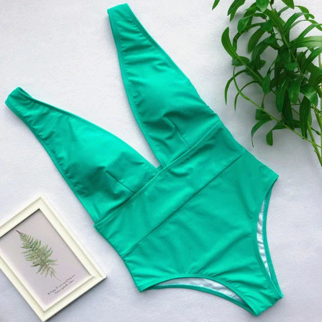 Women's black one-piece swimsuit with steel support structure and Brazilian bikini design