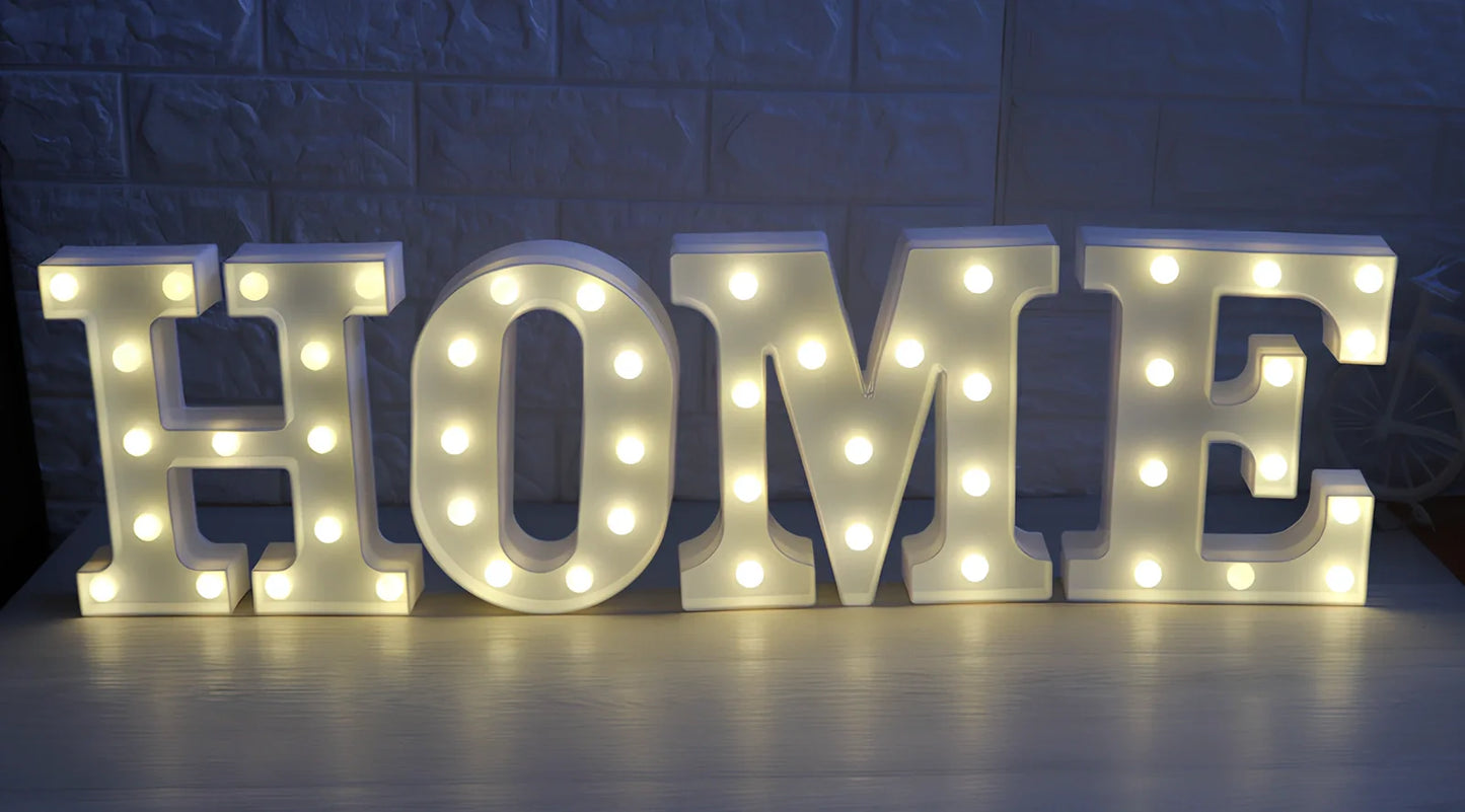 White plastic LED alphabet marquee sign with warm white illumination, 22cm height with battery operation