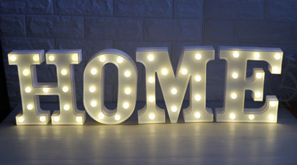White plastic LED alphabet marquee sign with warm white illumination, 22cm height with battery operation