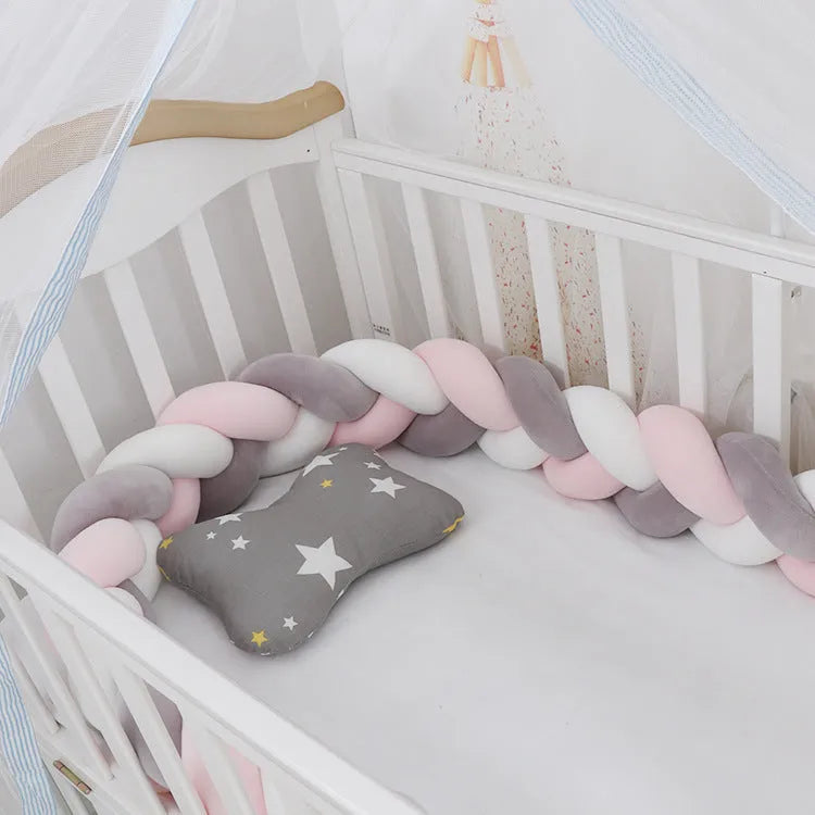 Braided knot design baby crib safety bumper in spandex velvet, shown in a light grey colour.