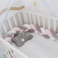 Braided knot design baby crib safety bumper in spandex velvet, shown in a light grey colour.