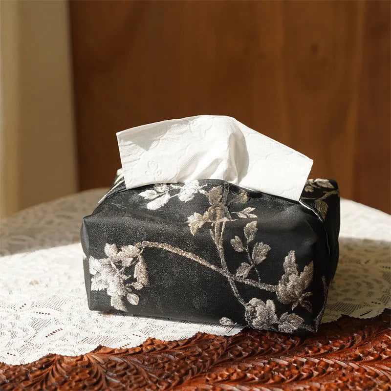 White embroidered Chinese brocade fabric tissue box with optional pearl buckle, shown on a table.