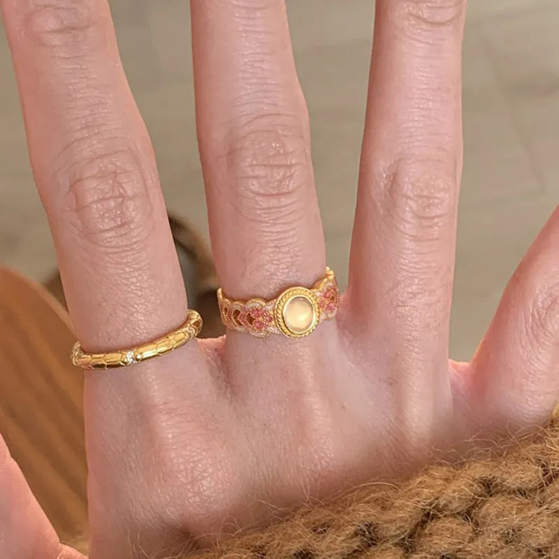 Pink crystal enamel geometric open mouth ring on a gold-plated copper band.