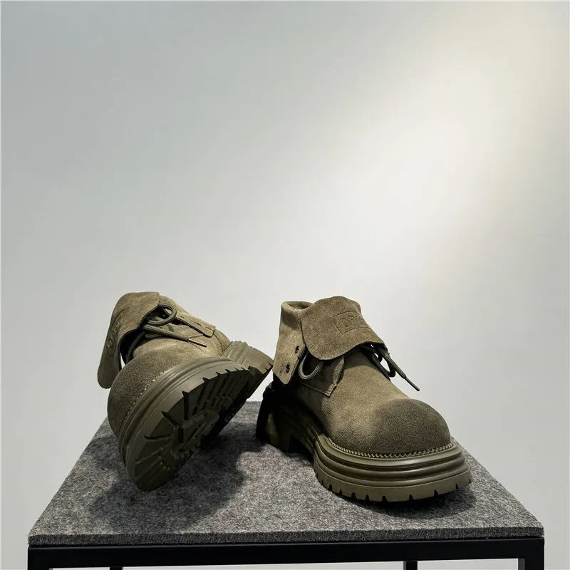 Men's distressed brown cow suede worker ankle boots with thick rubber soles and visible stitching.