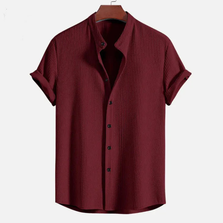 Short sleeve loose polyester fibre men's summer shirt in light blue, shown front view on plain background