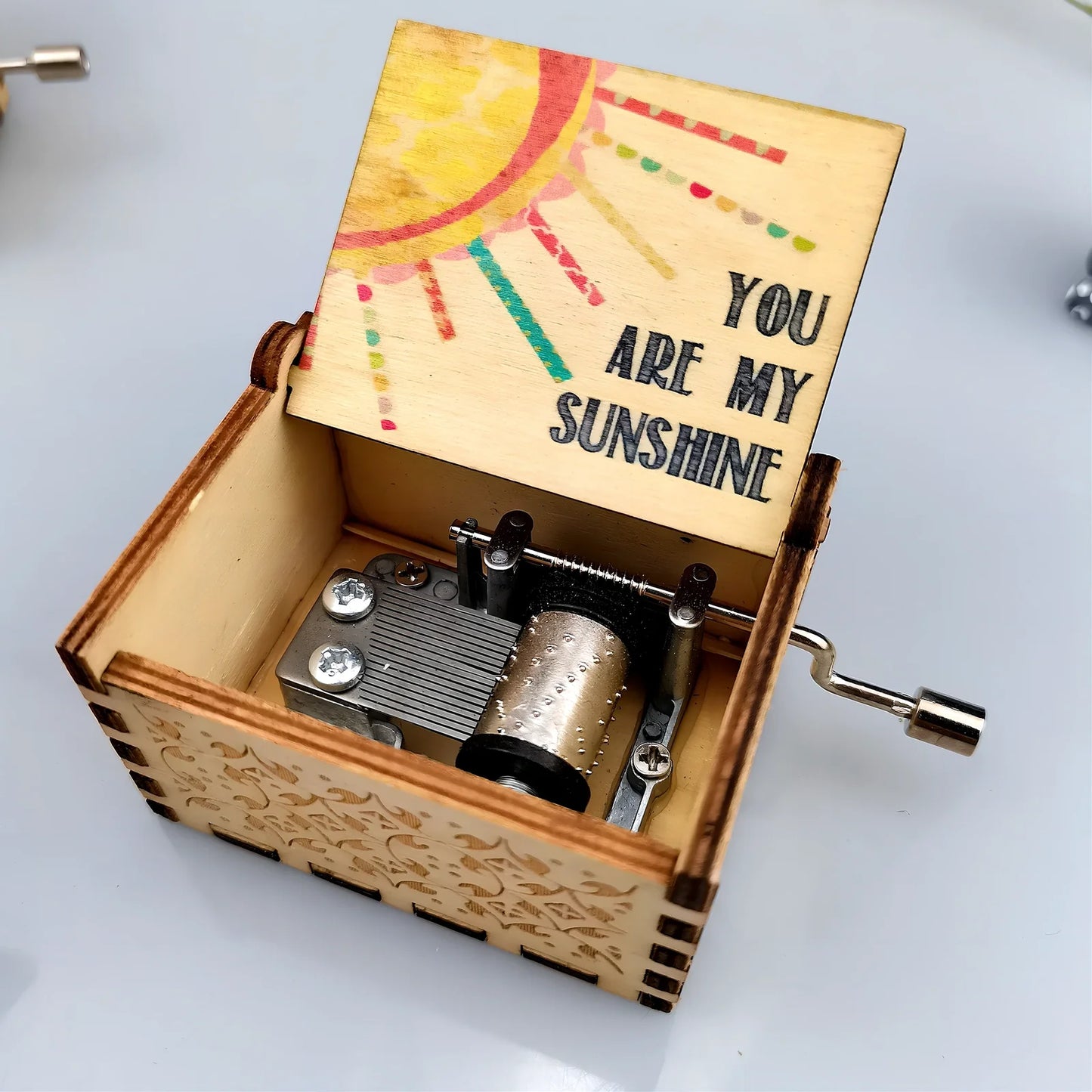 Antique boxwood music box with hand crank and yin carved Spirited Away landscape flowers, 10 cm tall wooden decoration