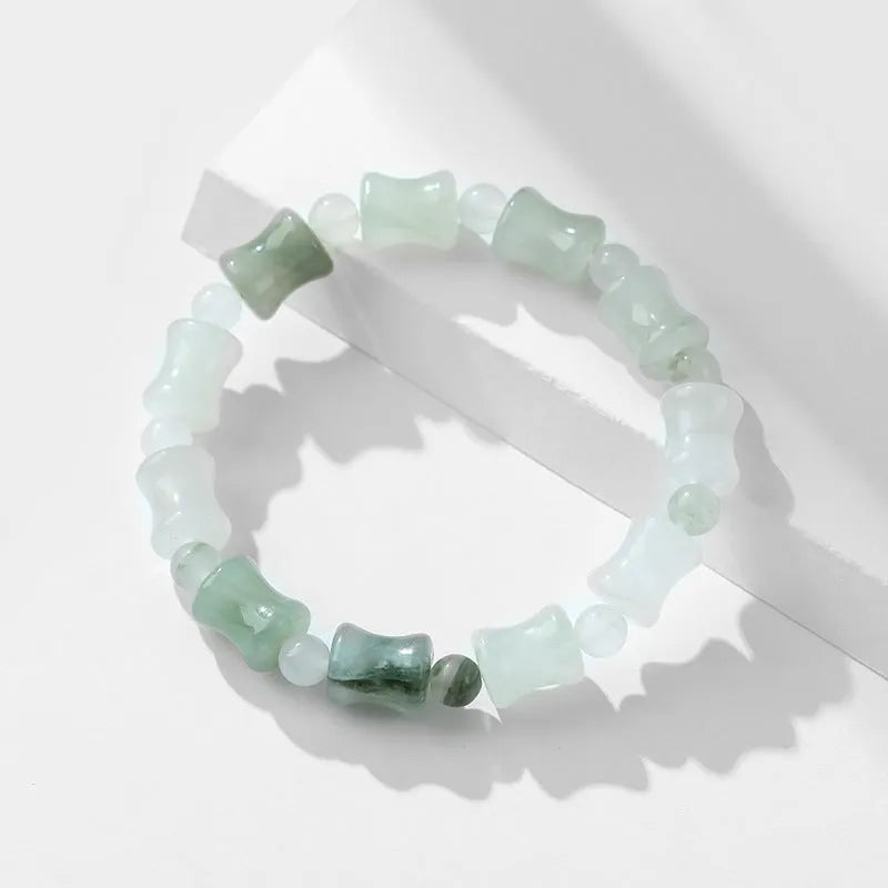 Tianshan Emerald and natural chalcedony diamond-cut beaded bracelet with coconut shell beads and a safety lock.
