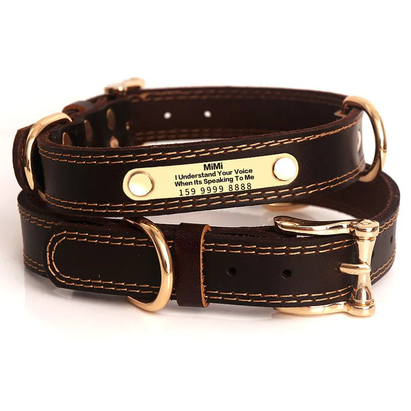 Genuine leather dog collar with engraved nameplate in brown on a wooden background