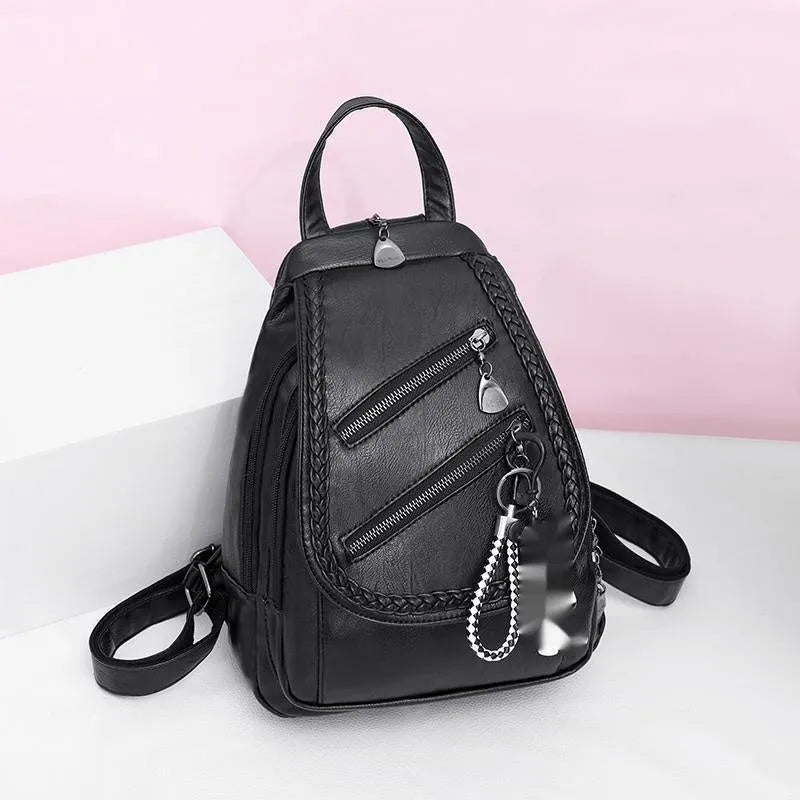 Soft PU leather dual-use chest backpack for ladies in black with visible sewing thread and zippered compartments
