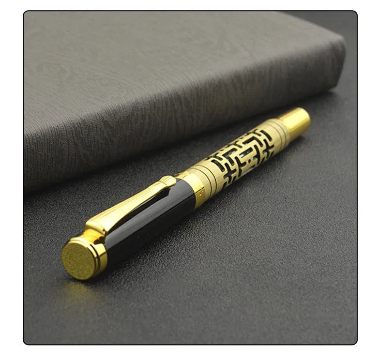 Yellow bronze metal fountain pen with iridium nib, 0.7mm big point, and gold trim, lying on a light surface