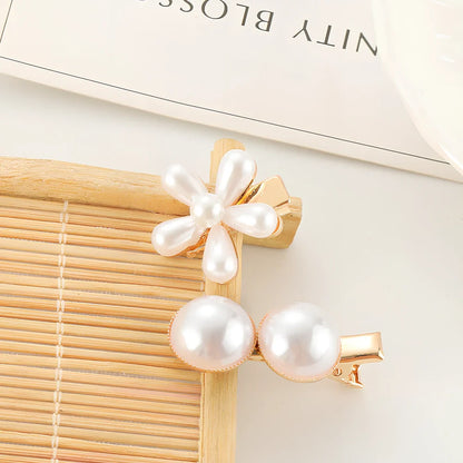 Slip-on pearl bow hair clip in alloy with flower at 2.4cm and pearls up to 7.2cm, secure grip design