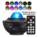 Black Bluetooth starry sky projection lamp with rotating water ripple laser effects on desktop