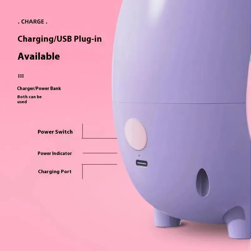 Purple household USB charging electric peeling machine with stainless steel blade on a kitchen counter