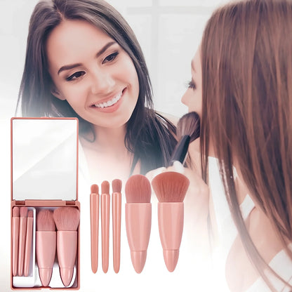 Pink 5-piece makeup brush set with mirror showing powder, foundation, blush, and eye brushes