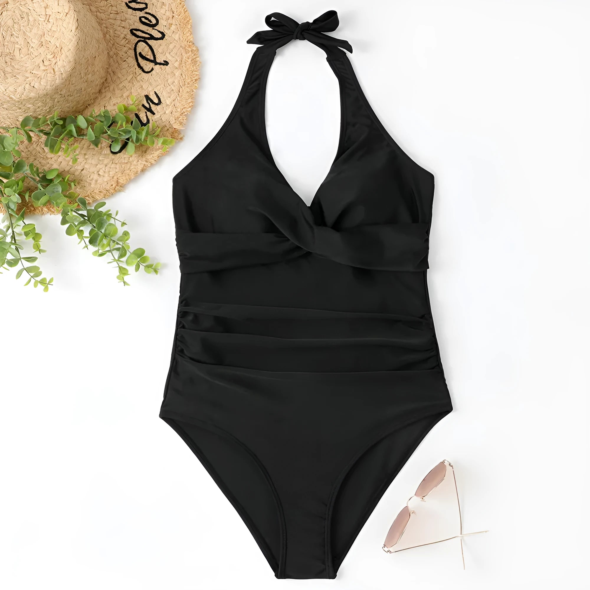 Women's black cross-front one-piece swimsuit laid flat, showing Asian size label.